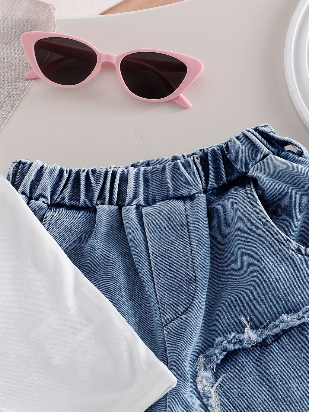 Girls White Tank Top and Heart Patch Denim Pants Outfit with a Matching Heart Bag for Casual Days