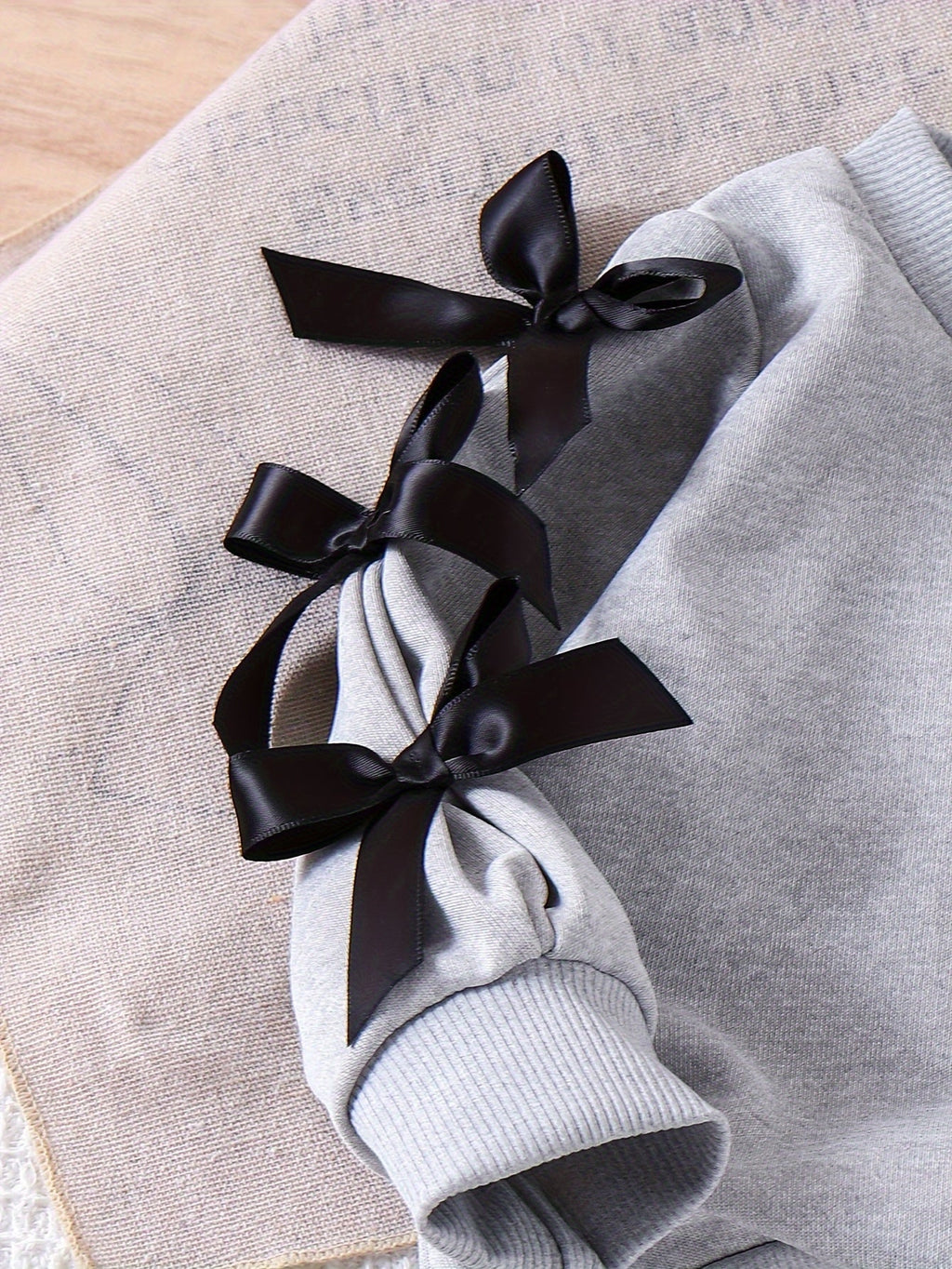 Baby Girls' Gray Sweatshirt and Pants Set with Black Bow Sleeves and Ribbed Cuffs for Everyday Wear