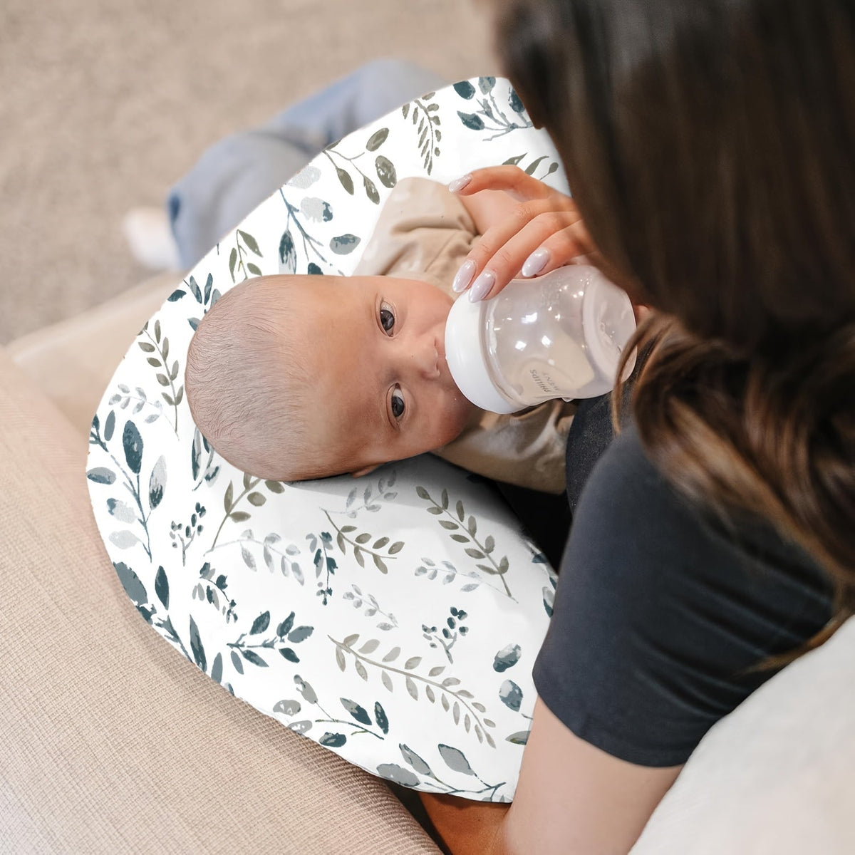 C-Shaped Nursing Pillow with a Removable Printed Cover for Supporting the Arms During Seated Feeding